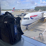 Mini Crew Luggage Tag in Navy and White on crew luggage tag with British Airways A350 Airplane In the Background in London Heathrow Airport