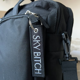 Sky Bitch Black and Silver Luggage Tag features on Airline Crew Bag 